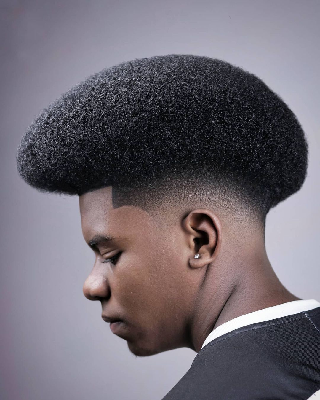 Fresh modern Afro fade with clean detailing.